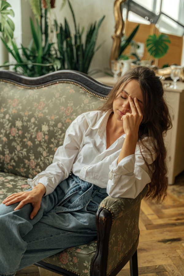 An exhausted woman, symbolic of someone managing a CPS investigation.